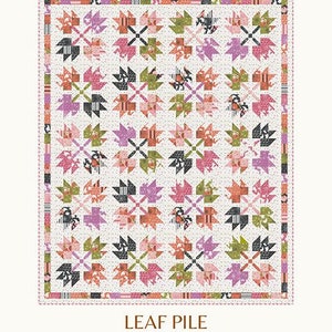 May include: A quilt pattern called "Leaf Pile" by Copper Kettle Quilt Company. The pattern features a colorful patchwork design with leaves in shades of pink, green, orange, and black. The pattern is available in runner and throw sizes. The text "CKQ-2405" is printed at the bottom of the image.