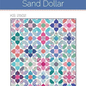 May include: A colourful quilt pattern titled "Sand Dollar" by Kate Spain. The design features a repeating pattern of squares and octagons in shades of pink, blue, green, and coral. The quilt has a white background and is labelled KS 2502.
