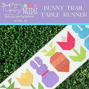 May include: A table runner pattern featuring a bunny, tulips, and carrots. The pattern is called "Bunny Trail Table Runner" and is from The Tipsy Needle. The finished size is 22 inches by 70 inches. The pattern is fat quarter and scrap friendly.