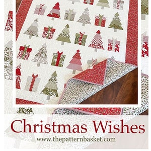 May include: A Christmas-themed quilt featuring a repeating pattern of Christmas trees and gift boxes in shades of red, green, and gray on a white background. The quilt has a red border and the text "Christmas Wishes".