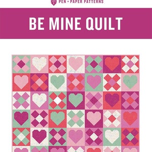 May include: A quilt pattern titled "Be Mine Quilt" with a grid of heart-shaped and square blocks in shades of pink, red, and green. The text "Pen + Paper Patterns" and "Standard Piecing Quilt Pattern for Beginner Level Sewers and Up" are also visible.