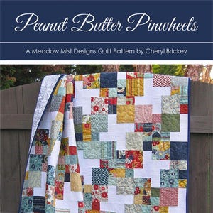 May include: A quilt pattern called "Peanut Butter Pinwheels" by Meadow Mist Designs. The pattern is a charm pack and layer cake friendly design available in baby, throw, and twin sizes.
