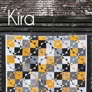 May include: A geometric quilt with a black border, featuring a pattern of squares and triangles in yellow, black, gray, and white. The quilt is labeled "Kira" and is a 10-inch square quilt. The dimensions are 97" x 114".