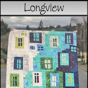 May include: A colorful quilt with a geometric pattern of squares and rectangles. The quilt is made up of various shades of blue, green, yellow, and white. The quilt is labeled "Longview" and "Saginaw St Quilts" with the number "P464" in the bottom left corner.