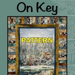 May include: A quilt pattern titled "On Key" with a landscape scene. The quilt features a central image of a snowy landscape with a cabin, framed by a border of patterned fabric strips. The word "PATTERN" is displayed in large yellow letters.