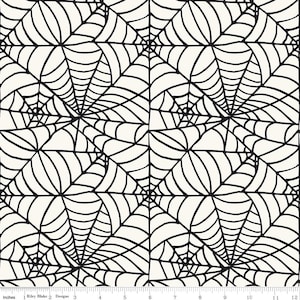 May include: Black and white spiderweb pattern fabric. The fabric has a repeating pattern of spiderwebs.