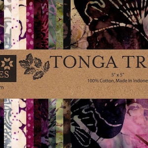 May include: A fabric bundle labeled "Tonga Treats" with a variety of colorful batik fabric squares. The label reads "Timeless Treasures" and "5 x 5" with the text "100% Cotton, Made In Indonesia". The fabric squares are in shades of purple, pink, and green.