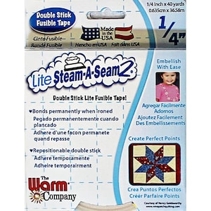 May include: A roll of 1/4 inch wide double stick fusible tape, labeled "Lite Steam-A-Seam 2". The tape is made in the USA and is repositionable. The packaging features a blue and white illustration of a steam iron and the text "Create Perfect Points".