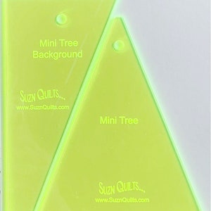 May include: Two lime green acrylic quilting rulers with the text "Mini Tree" and "Mini Tree Background" printed on them. The rulers are made by Suzn Quilts and have the website address www.SuznQuilts.com printed on them.