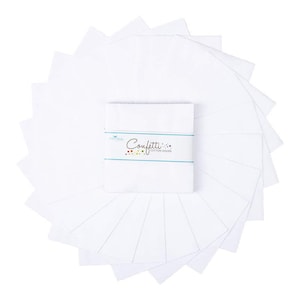 May include: A stack of white fabric squares arranged in a circular pattern, surrounding a wrapped bundle of fabric squares. The wrapped bundle has the word "Confetti" printed on it, along with the words "Cotton Solids".