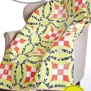 May include: A quilt featuring a repeating pattern of lime green, black, and white floral motifs, and red and white checkered squares. The text reads Sew Kind of Wonderful Contemporary Quilt Designs, Urban Nine Patch, #109, and QCR Pattern 40 x 60.