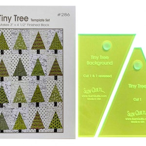 May include: A template set for quilting, called "Tiny Tree", with two clear acrylic templates. The templates are labeled "Tiny Tree Background, Cut 1 & 1 reversed" and "Tiny Tree, Cut 1".