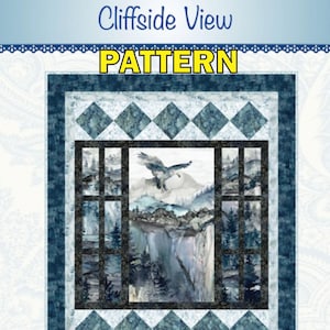 May include: A quilt pattern titled Cliffside View featuring a central window-pane design. The image displays a landscape with an eagle flying over mountains, cliffs, and pine trees in shades of blue, white, and gray, framed by a dark blue border.