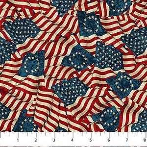 May include: A fabric pattern featuring a repeating design of waving American flags with a vintage, distressed texture. Each flag displays a blue canton with a circular arrangement of white stars and horizontal red and white stripes. A ruler shows 8 inches.