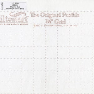May include: A white fabric sheet with a 1 1/2 inch grid pattern. The sheet is labelled "Quiltsmart The Original Fusible 1 1/2" Grid (288) 1" finished squares, 12 x 24 grid".