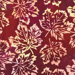 May include: A fabric pattern featuring a repeating design of stylized maple leaves. The leaves are a creamy off-white color, set against a deep burgundy background with subtle variations in tone. The leaves have detailed veining.