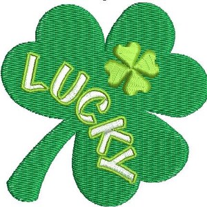 May include: Embroidered green shamrock with the word "LUCKY" in white script. A smaller four-leaf clover is in the upper right corner. The design has a textured, stitched appearance, perfect for St. Patrick's Day.