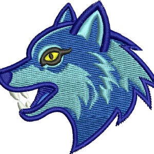 May include: An embroidered patch featuring the profile of a wolf head in shades of dark blue and light blue. The wolf has a yellow eye with a black pupil, a dark blue outline, and two visible white fangs protruding from its open mouth.