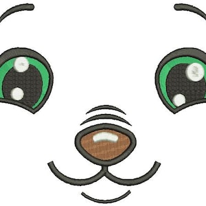 May include: A cartoon face design featuring large green eyes with white highlights, black eyelashes, and a brown nose. The design is outlined in black. The face is a simple, cute design.