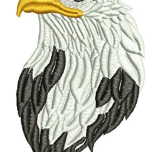 May include: Embroidered design of an eagle's head, with a yellow beak and eye, and white and black feathers. The design is detailed and suitable for apparel or decorative items.