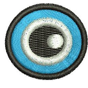 May include: Circular embroidered patch with a detailed design. The patch showcases concentric circles in black, light blue, white, and a dark grey centre with a white dot. It has a stitched border.