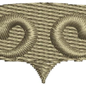 May include: An embroidered design featuring two stylised swirls in an oval shape with a pointed bottom, in a beige colour.