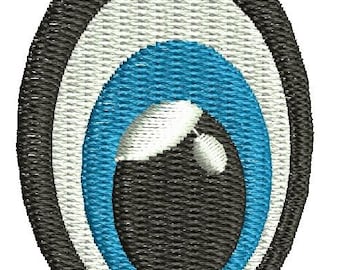 May include: Embroidered eye patch with a black, white, and blue design. The eye features a black outer ring, a white middle ring, and a bright blue inner ring. A white highlight and pupil are visible.
