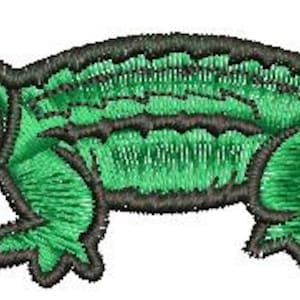 May include: Green embroidered alligator patch with a toothy grin. The alligator is outlined in black and has a textured green body.