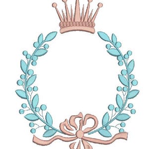 May include: An embroidered design featuring a crown above a wreath. The wreath is composed of blue-green leaves and berries, with a bow at the bottom. The crown and bow are in a soft peach color, creating a delicate and elegant aesthetic.