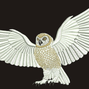 May include: White snowy owl with wings spread wide, in flight, with gold accents on the feathers and eyes. The owl is against a black background.