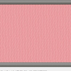 May include: A pink fabric patch with a gray border. The patch is rectangular and has a textured surface.