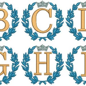 May include: Ten embroidered designs of letters A through J, each letter is surrounded by a blue laurel wreath and a silver crown.