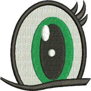 May include: Embroidered eye design featuring a black outline, a white background, a green iris, and a black pupil with two white highlights. The eye includes black eyelashes and a lower lash line, creating a cartoonish aesthetic.