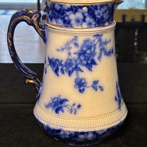 May include: A rustic wooden sign with the text "Welcome to our home" in white lettering. The sign has a distressed finish and a simple, inviting design, ideal for entryway decor.