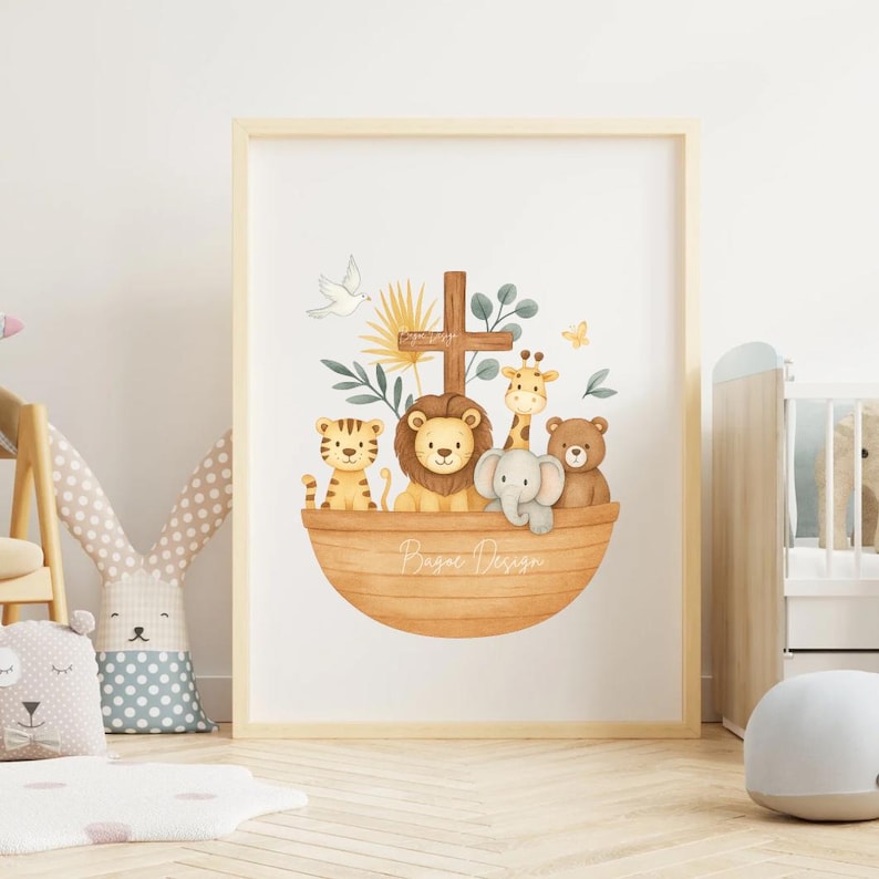 May include: A framed watercolor print featuring a wooden ark filled with cartoon animals: a tiger, lion, giraffe, elephant, and bear. A cross and dove are above the ark. The print has a light wood frame and the words "Basac Design" are on the ark.