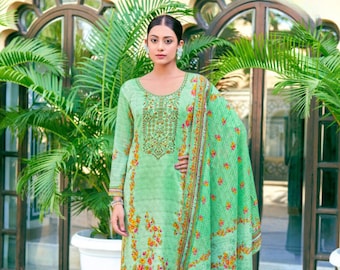 Può includere: Un completo salwar kameez verde chiaro con motivi floreali gialli, arancioni e rossi. La tunica a maniche lunghe presenta ricami intricati intorno allo scollo. Il set include pantaloni a gamba larga abbinati e una sciarpa fantasia.