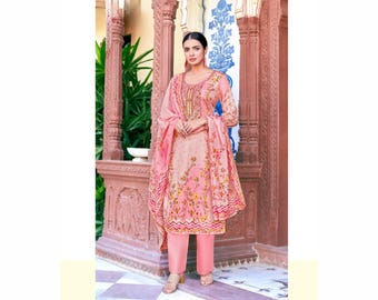 May include: A pink salwar kameez ensemble featuring a floral print, long sleeves, and matching pants. The outfit includes a dupatta and is adorned with gold embroidery. The image also includes the text "H-1299-004".