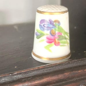 Four (sold together) Royal Worcester hand painted Thimbles