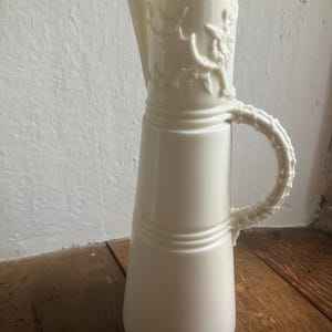 Victorian Royal Worcester aesthetic movement white China jug with ornate decoration height 22 cms