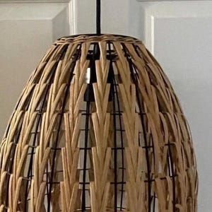 May include: A set of three ceramic mugs with a speckled, matte finish. The mugs are in shades of cream, light gray, and dark gray. Each mug has a simple, minimalist design, perfect for coffee or tea.