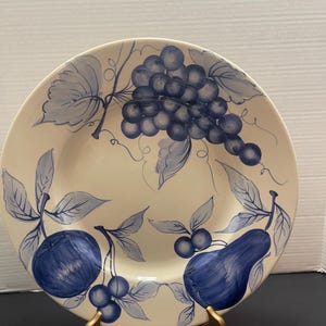 May include: A set of three ceramic mugs with a speckled, matte finish. Each mug features a different color: light blue, cream, and gray. The mugs have a simple, modern design and a comfortable handle.