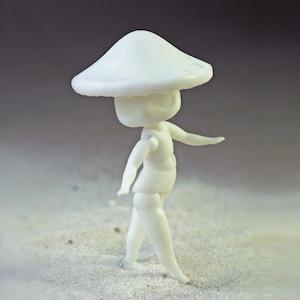 May include: A small, white figurine of a mushroom-headed character in a walking pose. The figure has articulated joints and is set against a neutral background. The mushroom cap is large and rounded.