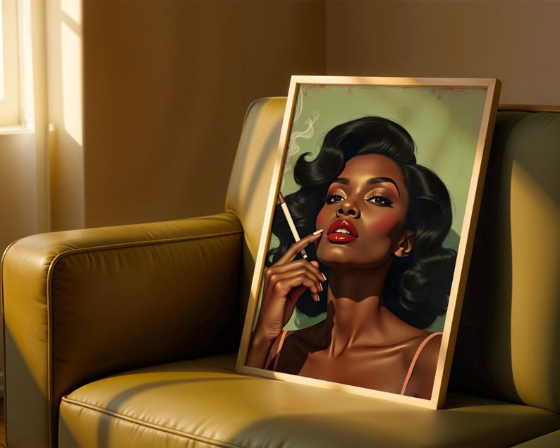 May include: A framed art print depicting a woman with dark hair, red lipstick, and a cigarette. The artwork has a vintage style, with a green backdrop and a gold frame. The print is displayed on a green leather armchair.