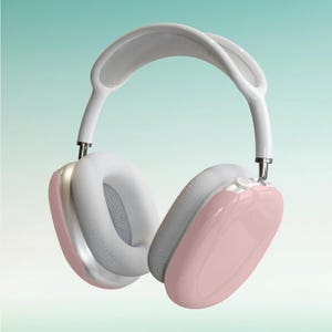 Puede incluir: Auriculares inalámbricos de diadema en rosa pastel y blanco. Los auriculares son de color rosa brillante, con almohadillas blancas y una diadema blanca. Los auriculares tienen un diseño moderno y minimalista.