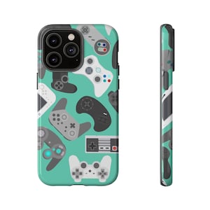 May include: A teal phone case with a repeating pattern of video game controllers in grey, white, and black. The case has a glossy finish and a black camera module.