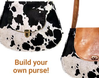 Bolsa artesanal personalizada com estampa de vaca sintética e couro.