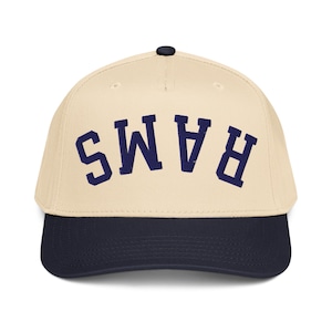 May include: A white ceramic mug with a black handle and the text "But First, Coffee" in a black, bold font. The mug is on a white surface. The mug is approximately 4 inches tall.