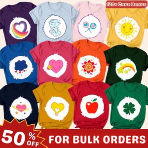 May include: A selection of brightly coloured t-shirts with Care Bear designs. Each shirt has a different Care Bear graphic on a white circle. The shirts are in various colours, including purple, blue, pink, yellow, and green. The text "120+ Care Bears" is visible.