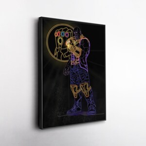 May include: Neon art print of a character in a black frame. The character is depicted in purple, gold, and blue, holding a golden gauntlet with colorful gems. A glowing circle with a hand holding the gauntlet is in the background.