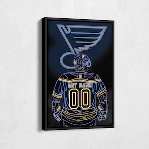 May include: A neon blue and yellow St. Louis Blues hockey player illustration with the text "ANY NAME 00" on the jersey.